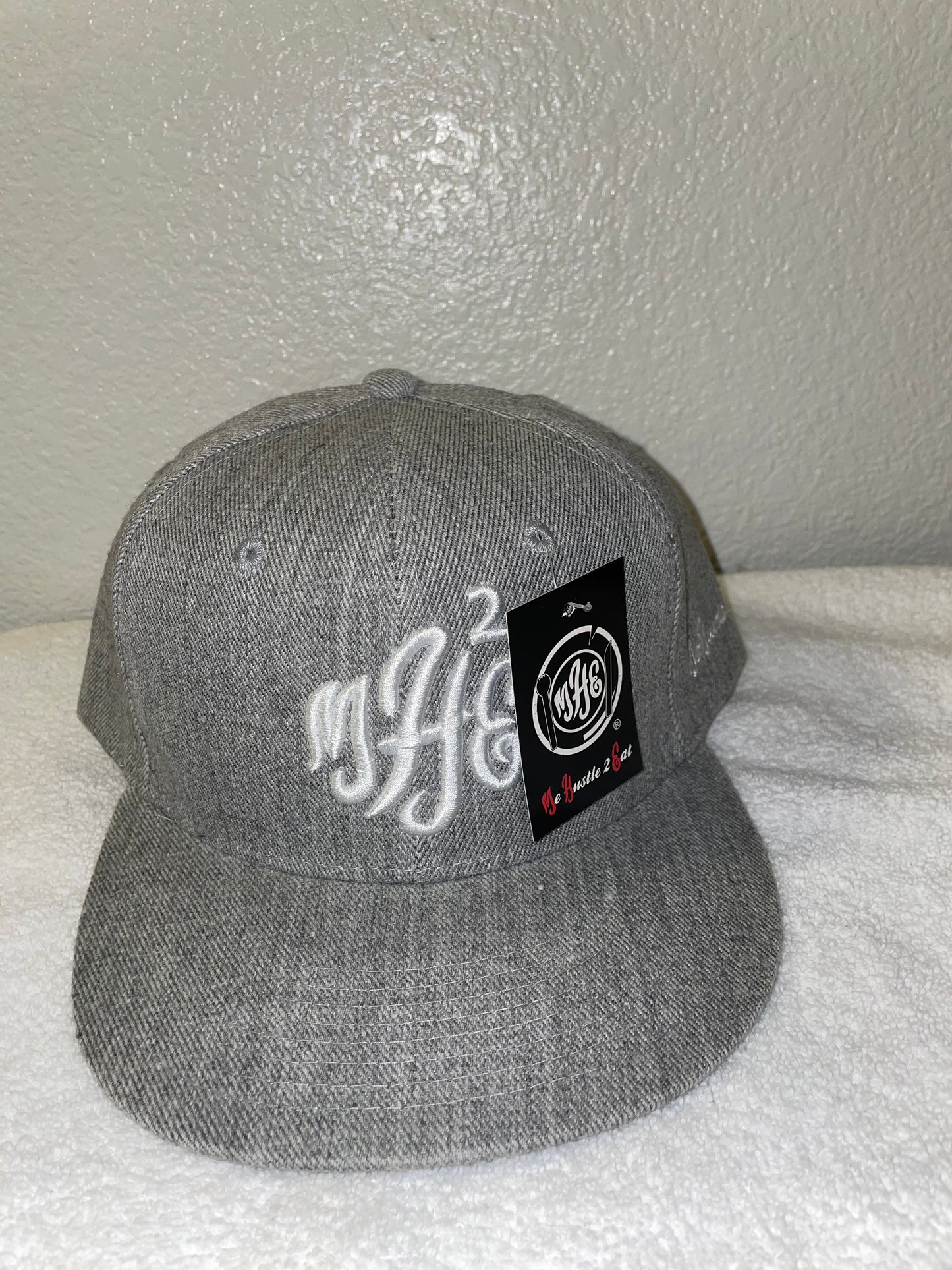 MH2E Trucker Hat - Embroidered White Logo